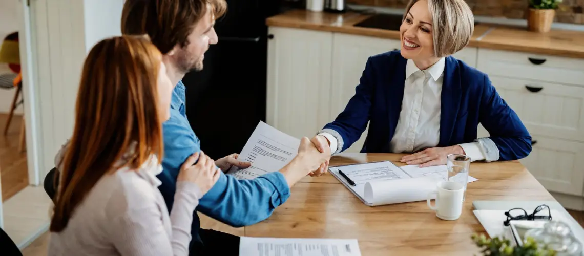 A property valuer reviewing a report with a client in Canberra