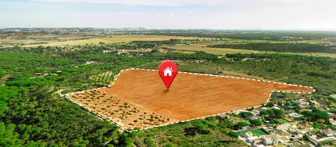 Property valuer in Melbourne inspecting land for future residential development